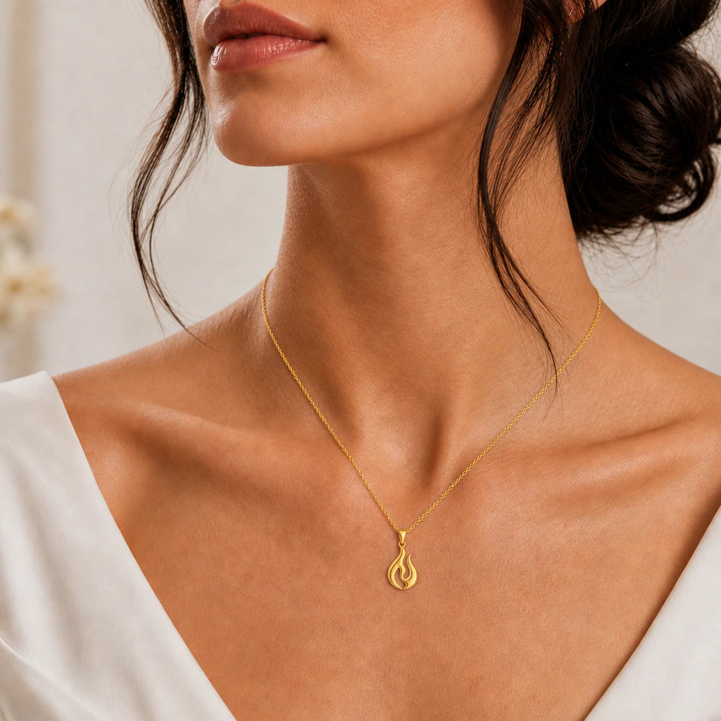 Flame pendant necklace worn, close-up