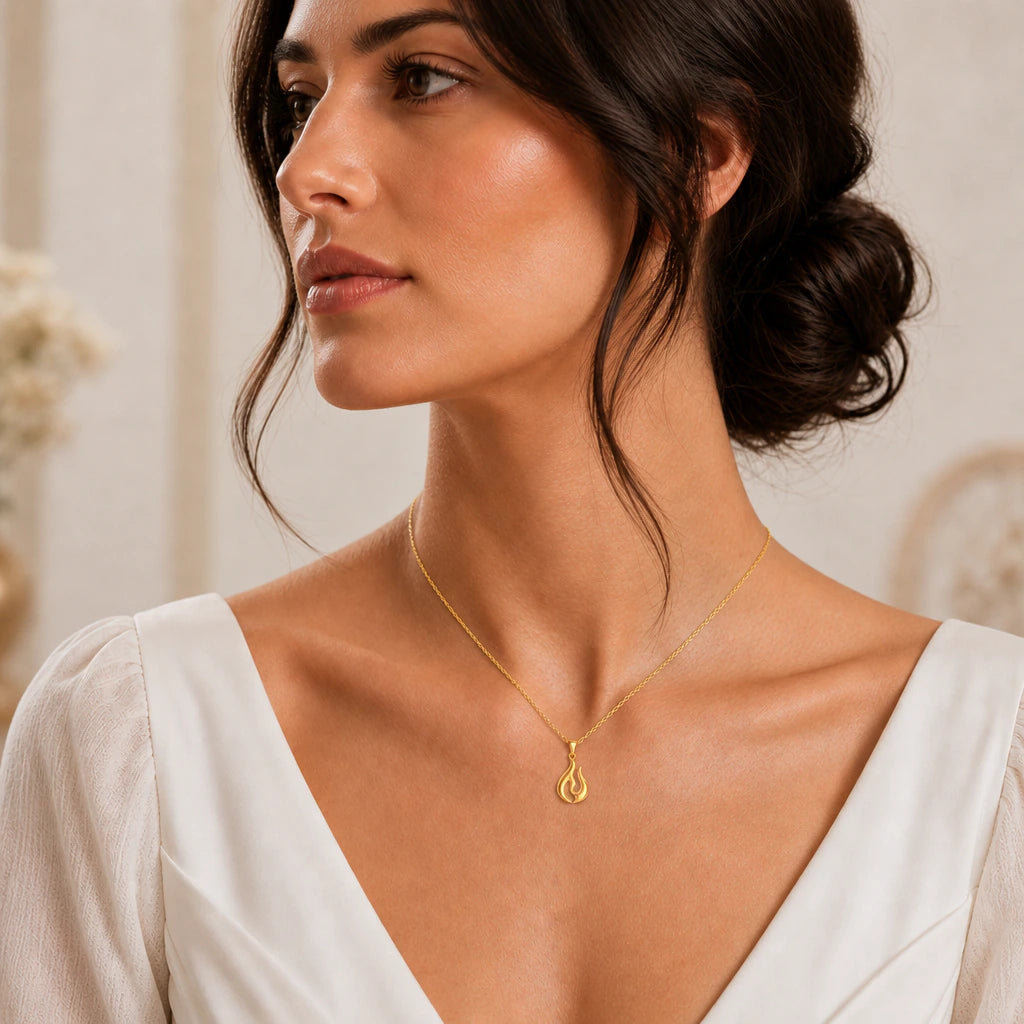 Flame pendant necklace worn by a model