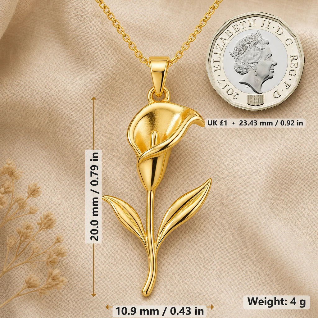 Calla lily necklace size image showing 20 mm height, 10.9 mm width and 4 g weight beside a UK pound coin