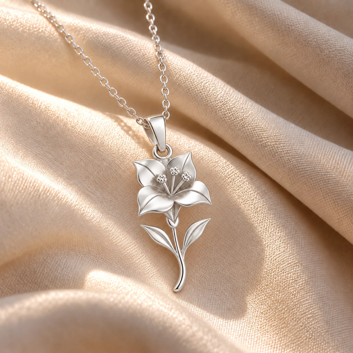 Sterling silver bougainvillea necklace on cream fabric