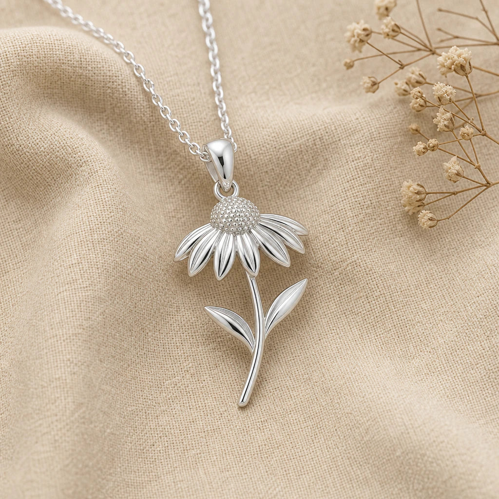 Close-up of silver echinacea pendant with beaded centre and swept back petals