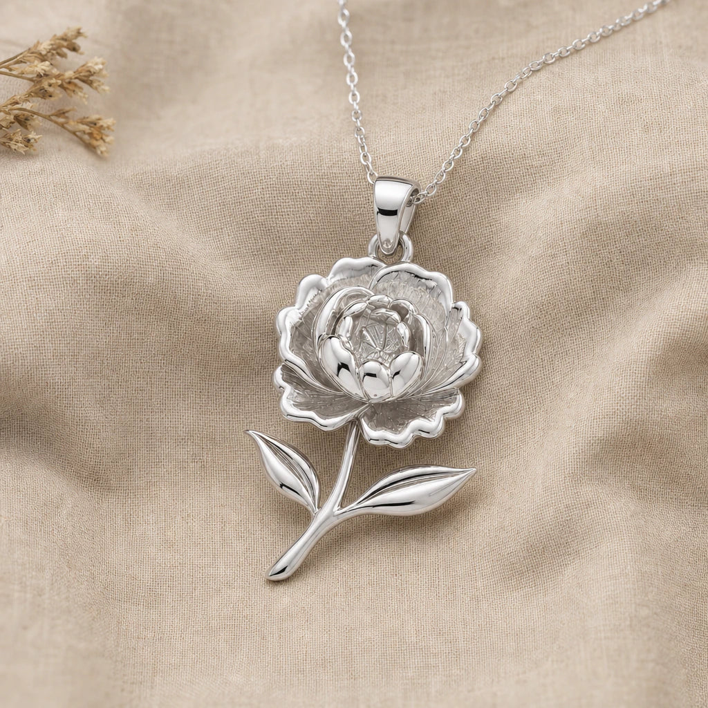 Close-up of silver peony pendant with layered ruffled petals