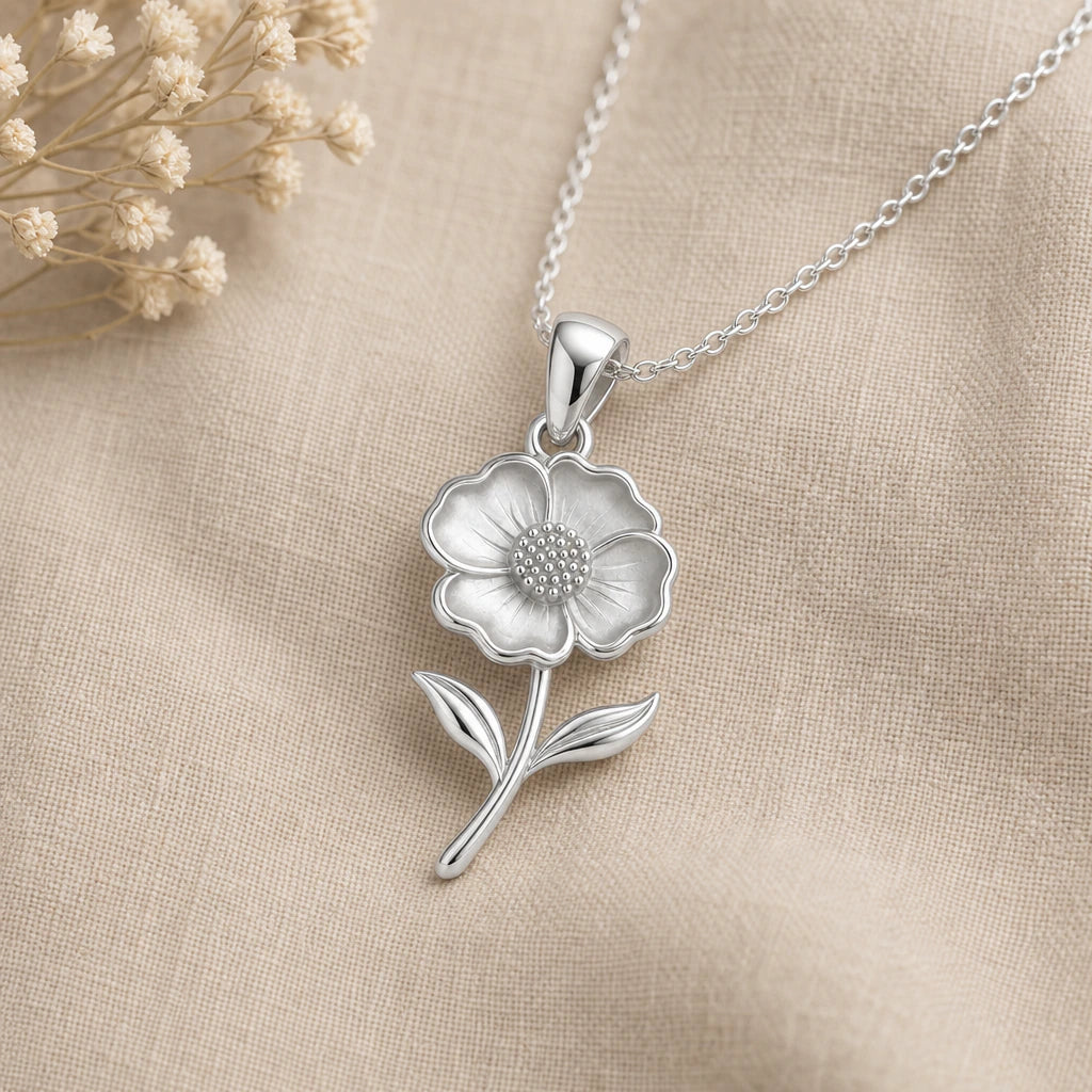 Close-up of silver open poppy pendant with satin petals and beaded centre