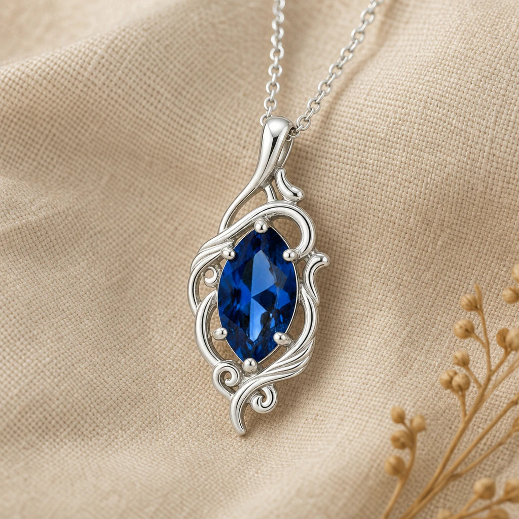 Close-up of silver elven vine pendant with marquise stone