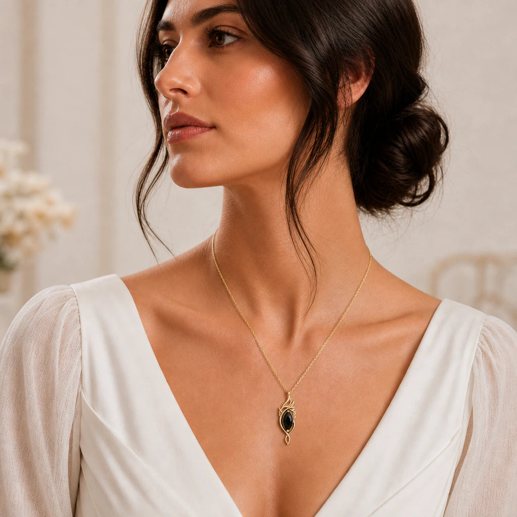 Elven flame birthstone pendant necklace worn by a model