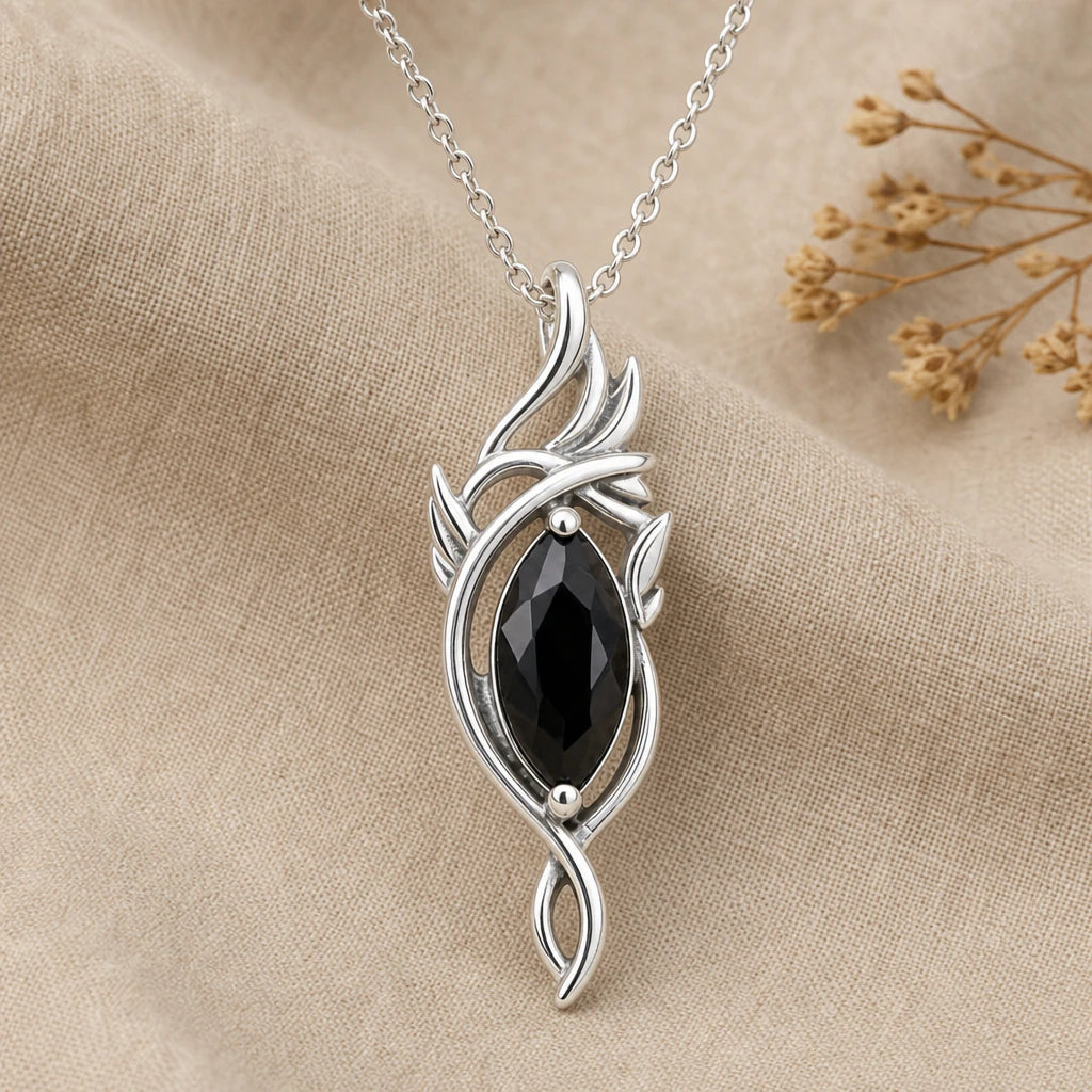 Close-up of silver elven flame pendant with marquise stone