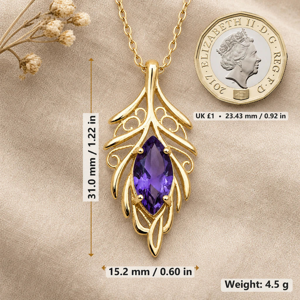 Elven leaf necklace size image showing 31 mm height, 15.2 mm width and 4.5 g weight beside a UK pound coin