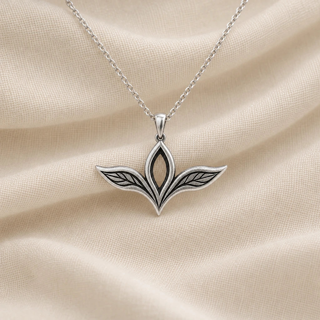 925 sterling silver elven leaf wing pendant necklace on cream fabric