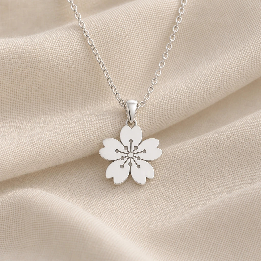 925 sterling silver sakura cherry blossom pendant necklace on cream fabric