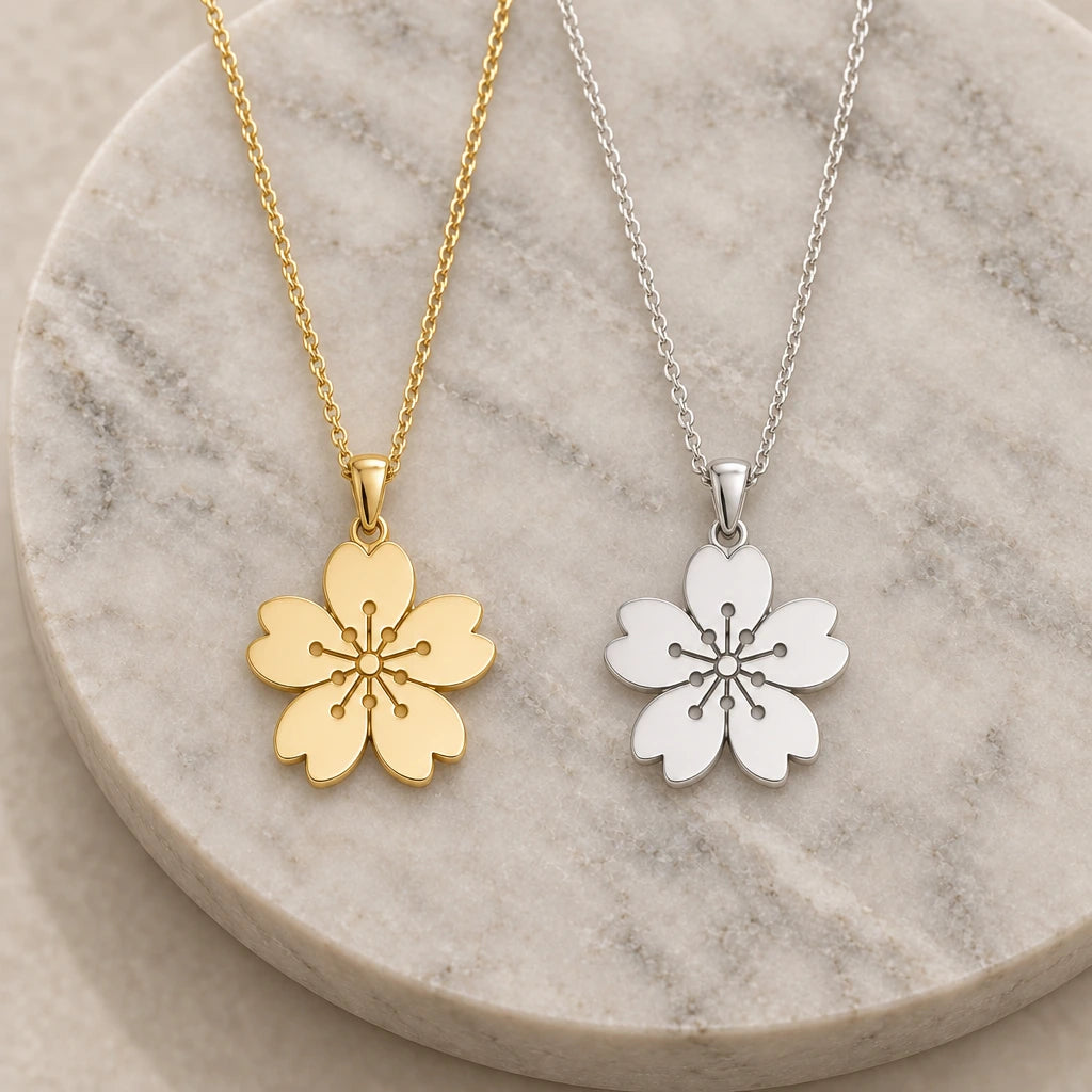 Sakura Cherry Blossom pendant necklace in silver and gold finishes side by side