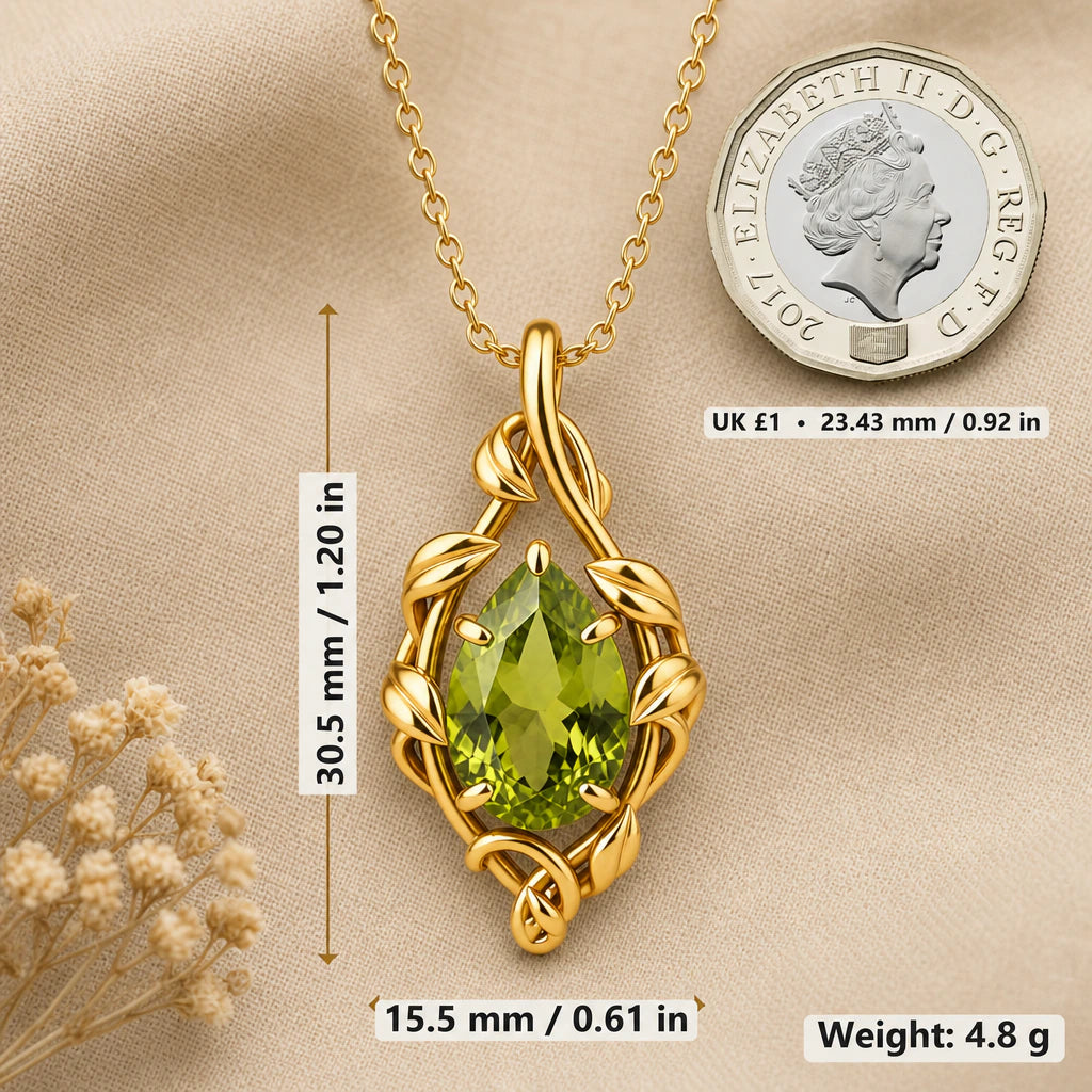 Teardrop vine necklace size image showing 30.5 mm height, 15.5 mm width and 4.8 g weight beside a UK pound coin