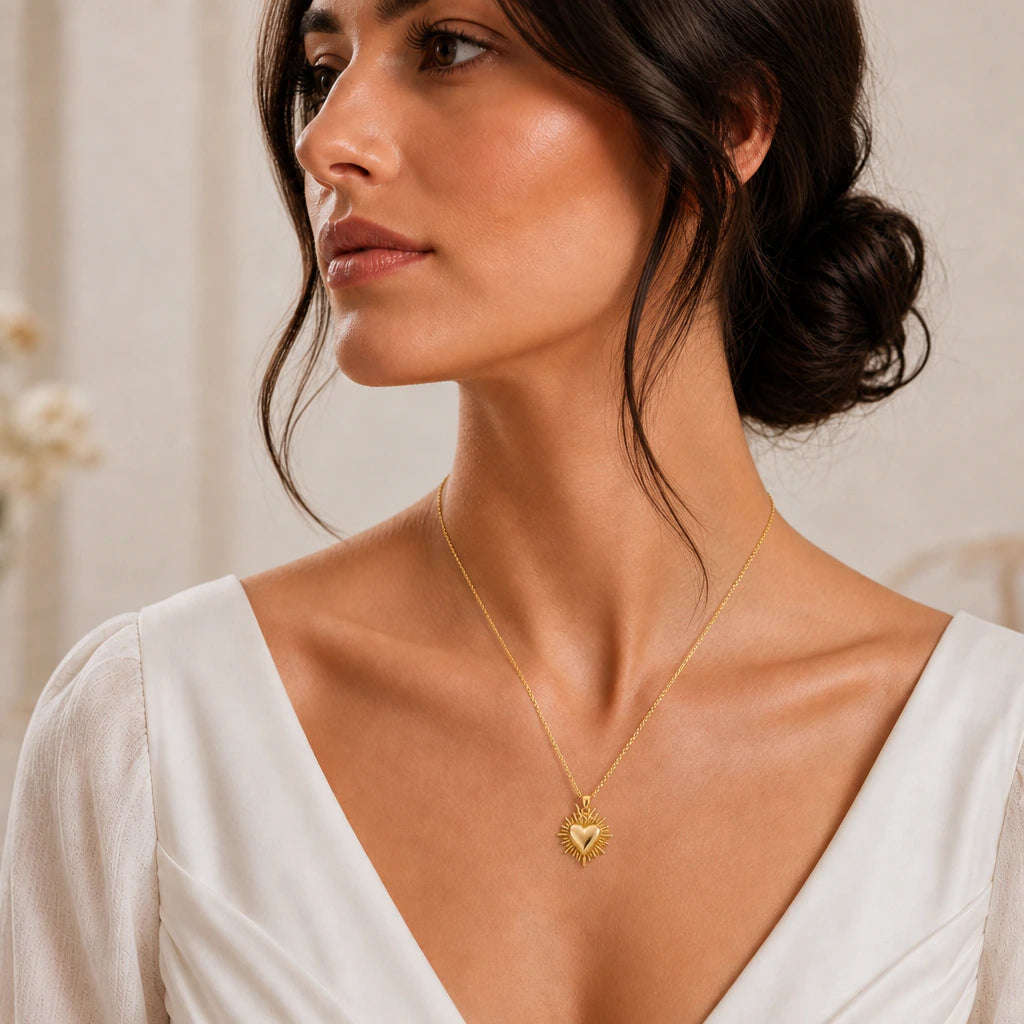 Sacred heart pendant necklace worn by a model