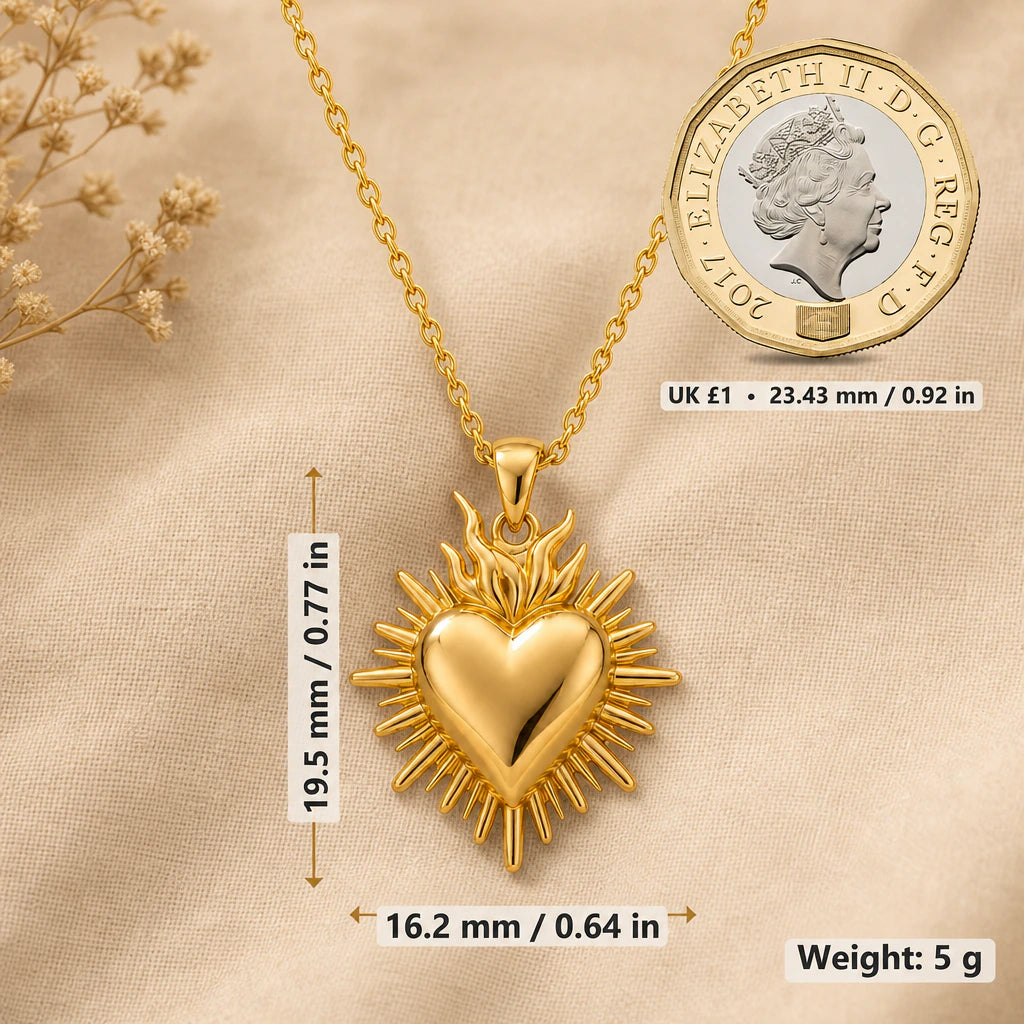 Sacred heart necklace size image showing 19.5 mm height, 16.2 mm width and 5 g weight beside a UK pound coin