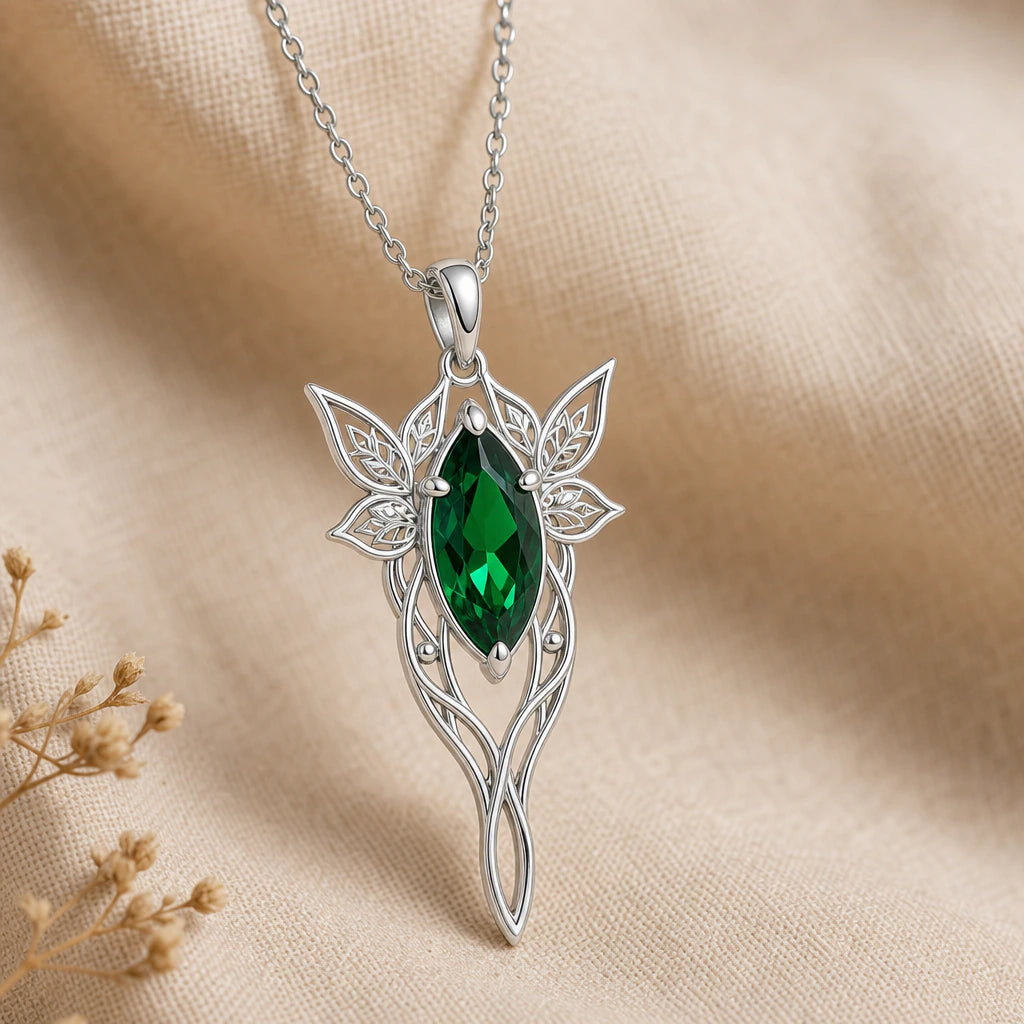 Close-up of silver guiding star pendant with marquise stone and leaf wings