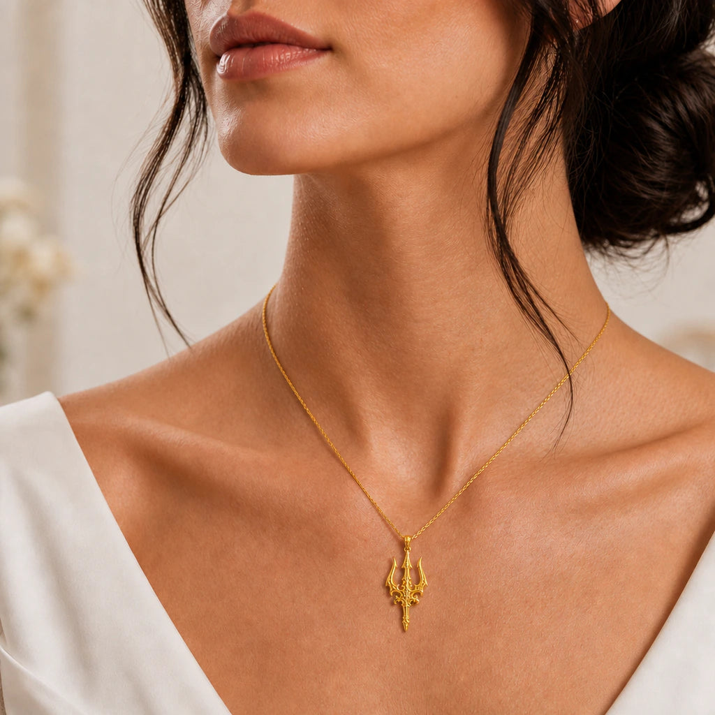 Trident pendant necklace worn, close-up