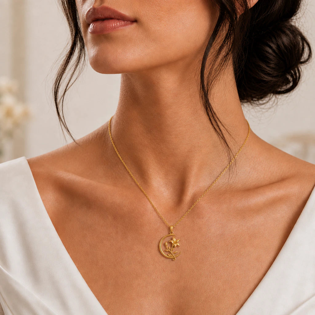 Crescent moon and lily pendant necklace worn, close-up