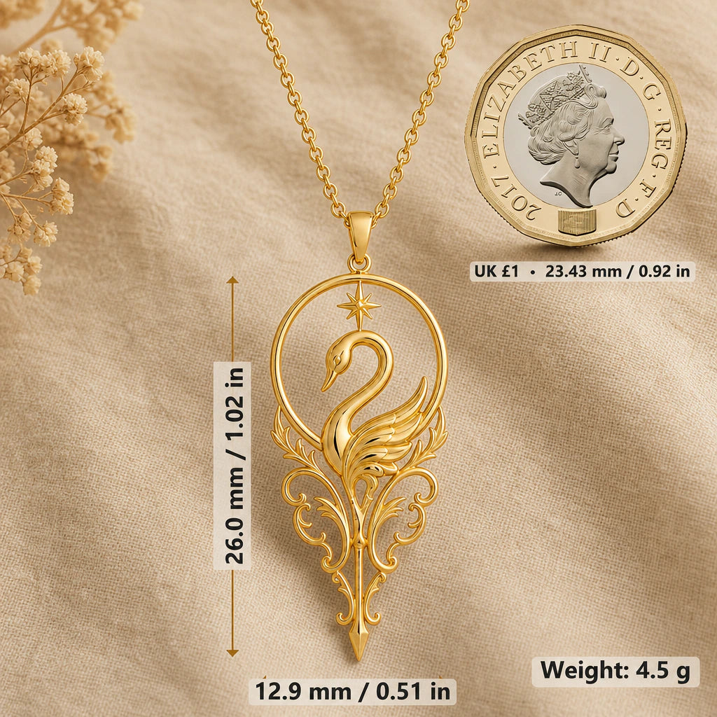 Swan necklace size image showing 26 mm height, 12.9 mm width and 4.5 g weight beside a UK pound coin