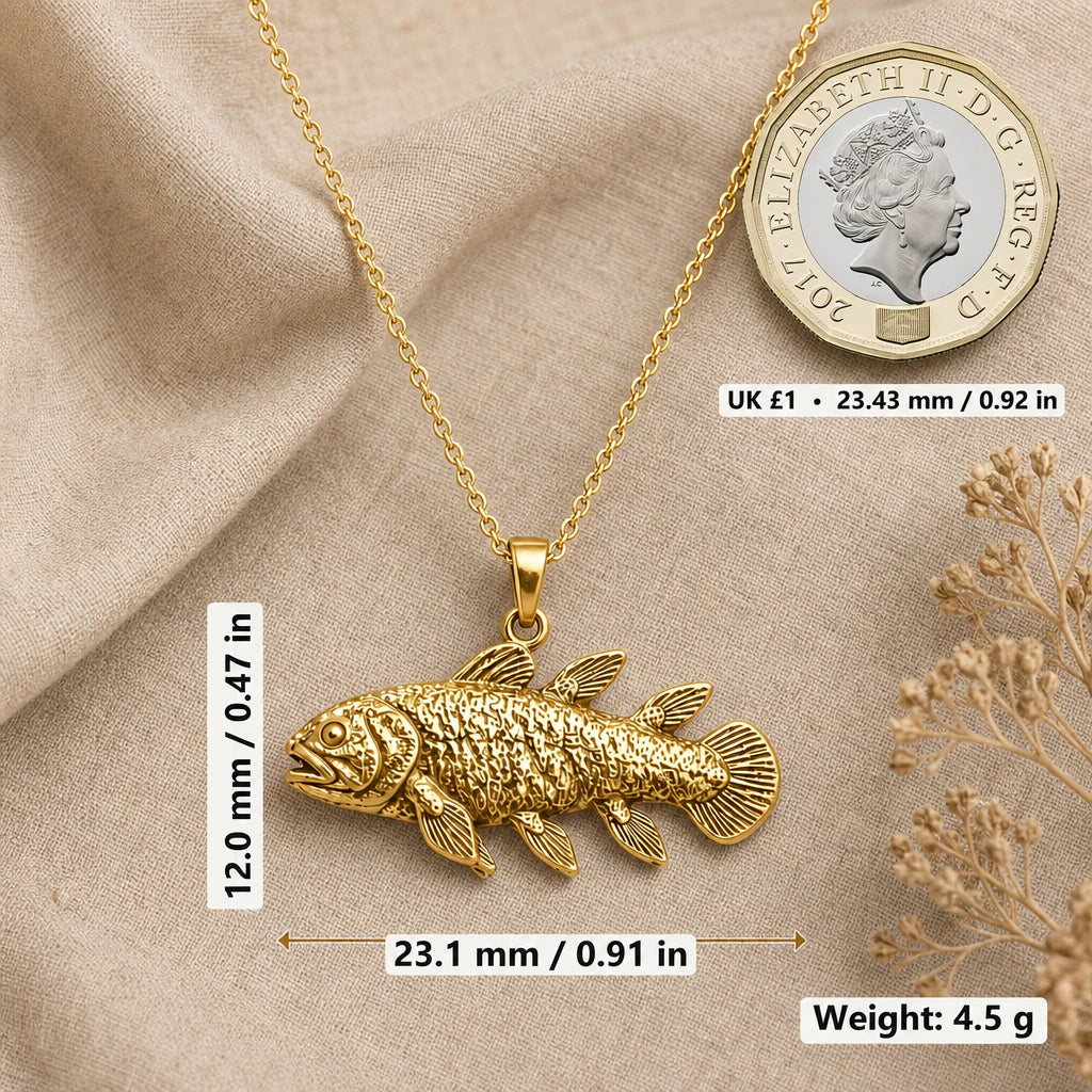 Coelacanth necklace size image showing 12 mm height, 23.1 mm width and 4.5 g weight beside a UK pound coin