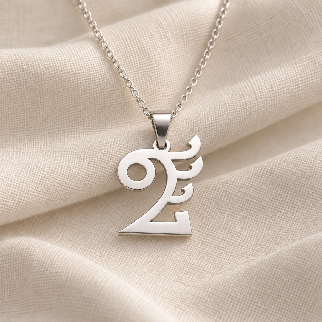 925 sterling silver quetzalcoatl symbol pendant necklace on cream fabric