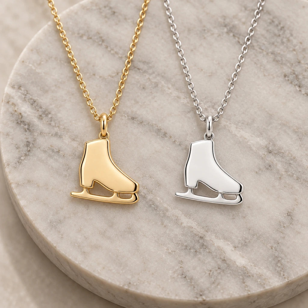 Ice Skate pendant necklace in silver and gold finishes side by side