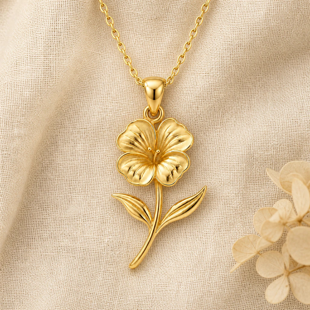 Nasturtium Flower pendant necklace in a warm gold finish on cream fabric