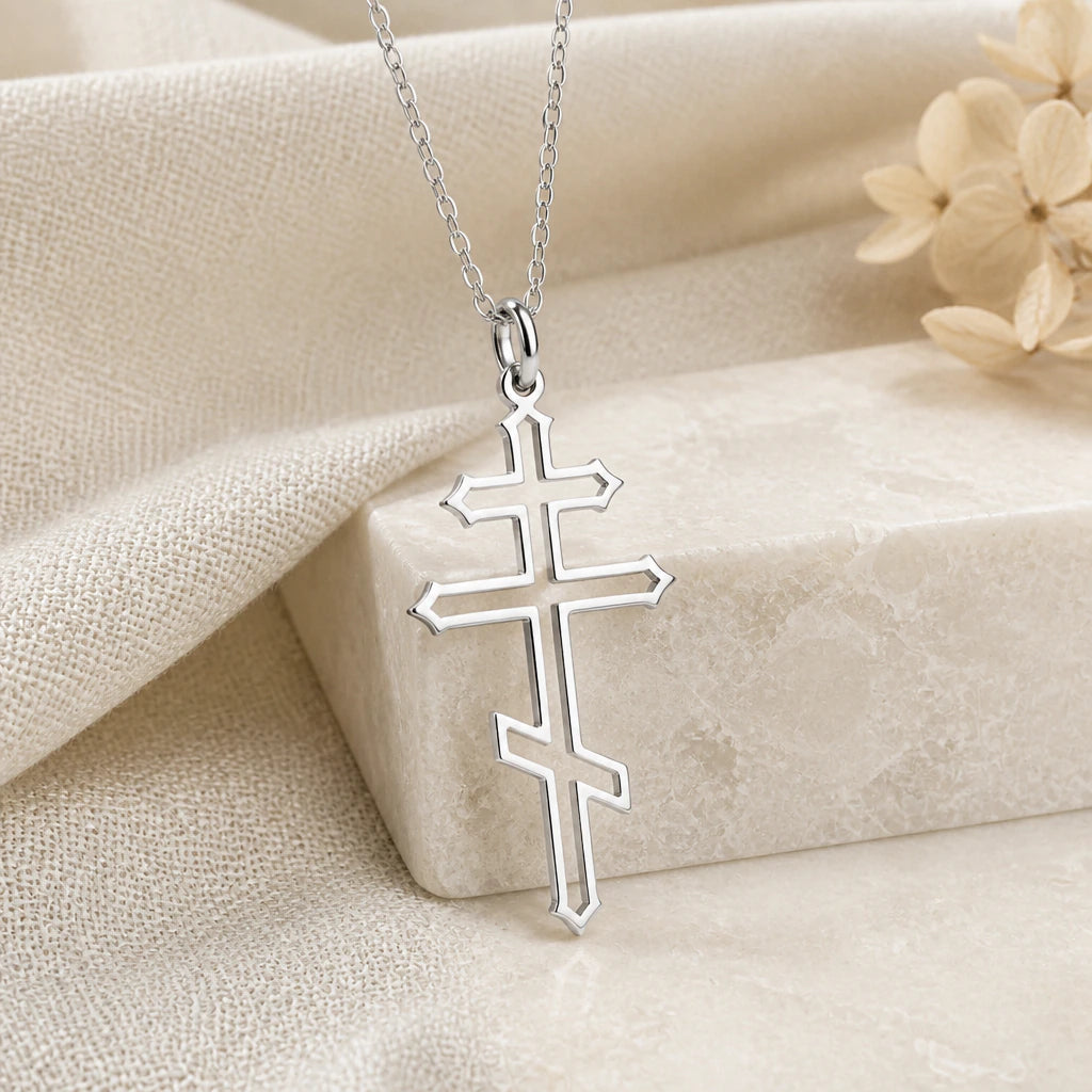 925 sterling silver orthodox cross pendant necklace on softly folded cream linen