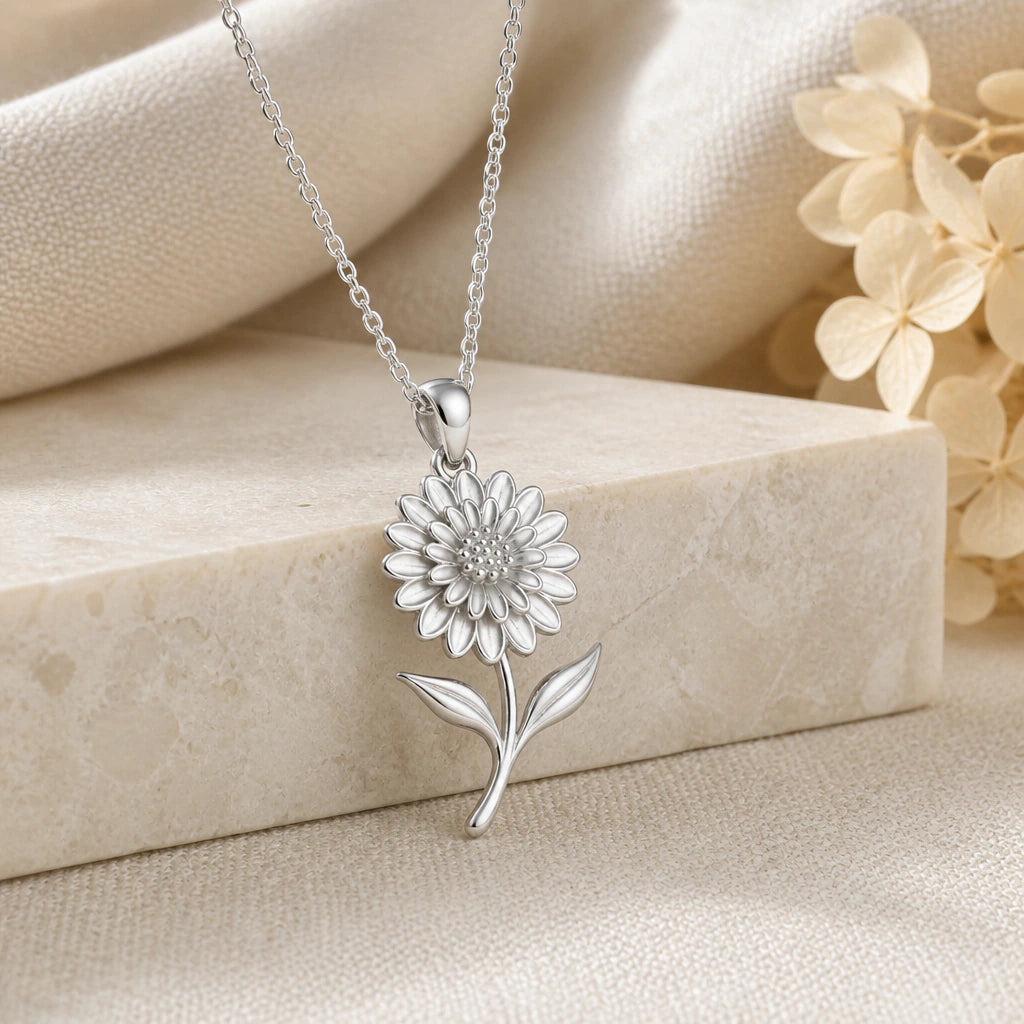 925 sterling silver dahlia flower pendant necklace on softly folded cream linen