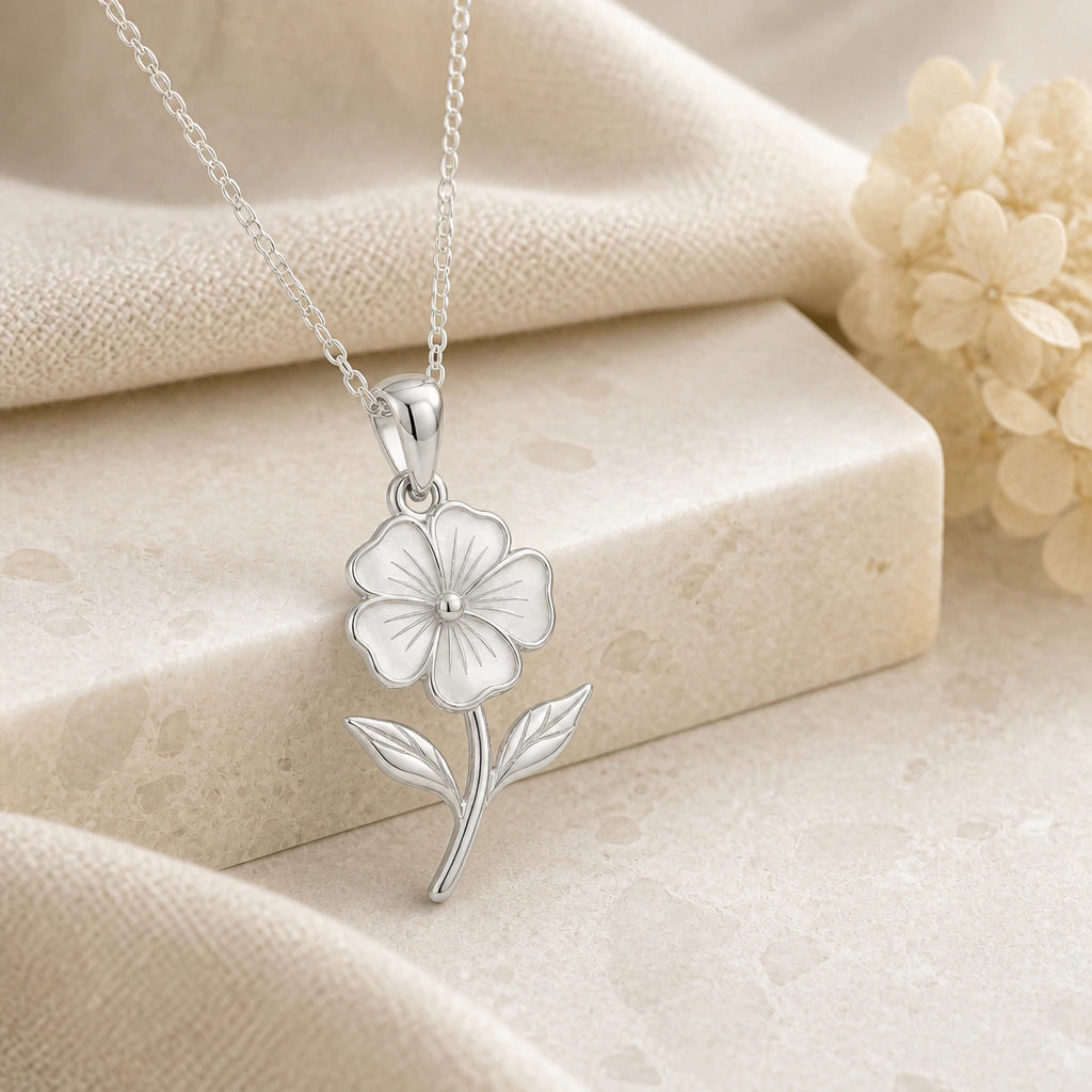 925 sterling silver phlox flower pendant necklace on softly folded cream linen