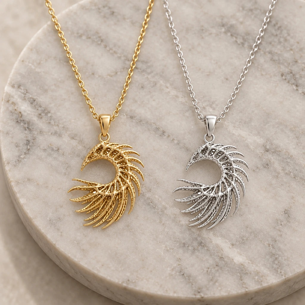 Eclipse Serpent Skeleton pendant necklace in silver and gold finishes side by side