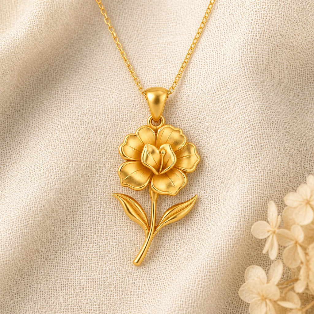 Gloxinia Flower pendant necklace in a warm gold finish on cream fabric