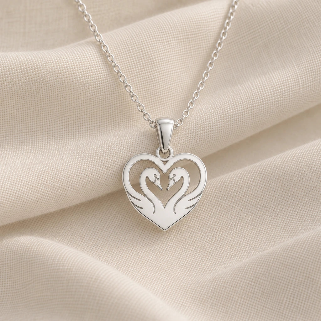 925 sterling silver heart swan pendant necklace on cream fabric