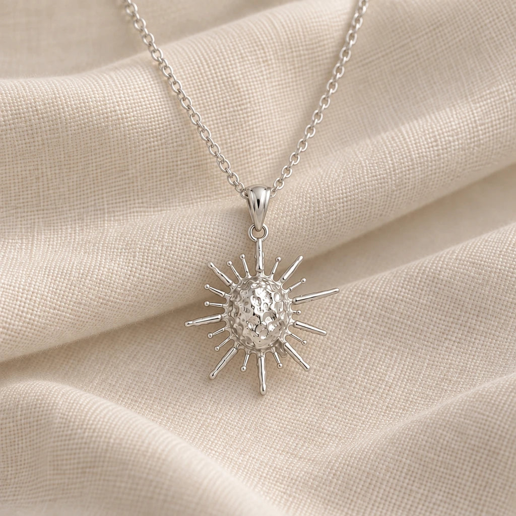 925 sterling silver solar fragment spiked sun pendant necklace on cream fabric