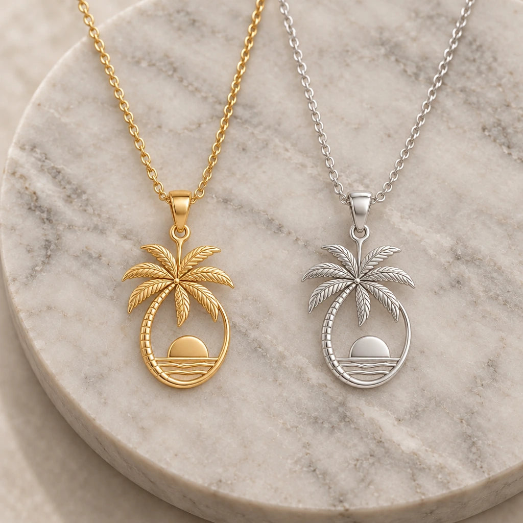 Palm Sunset pendant necklace in silver and gold finishes side by side