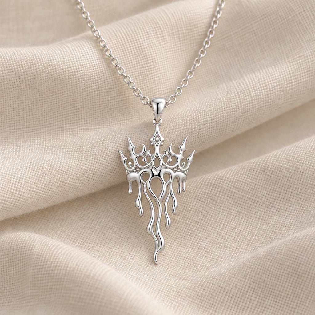 925 sterling silver crown drift melting crown pendant necklace on cream fabric