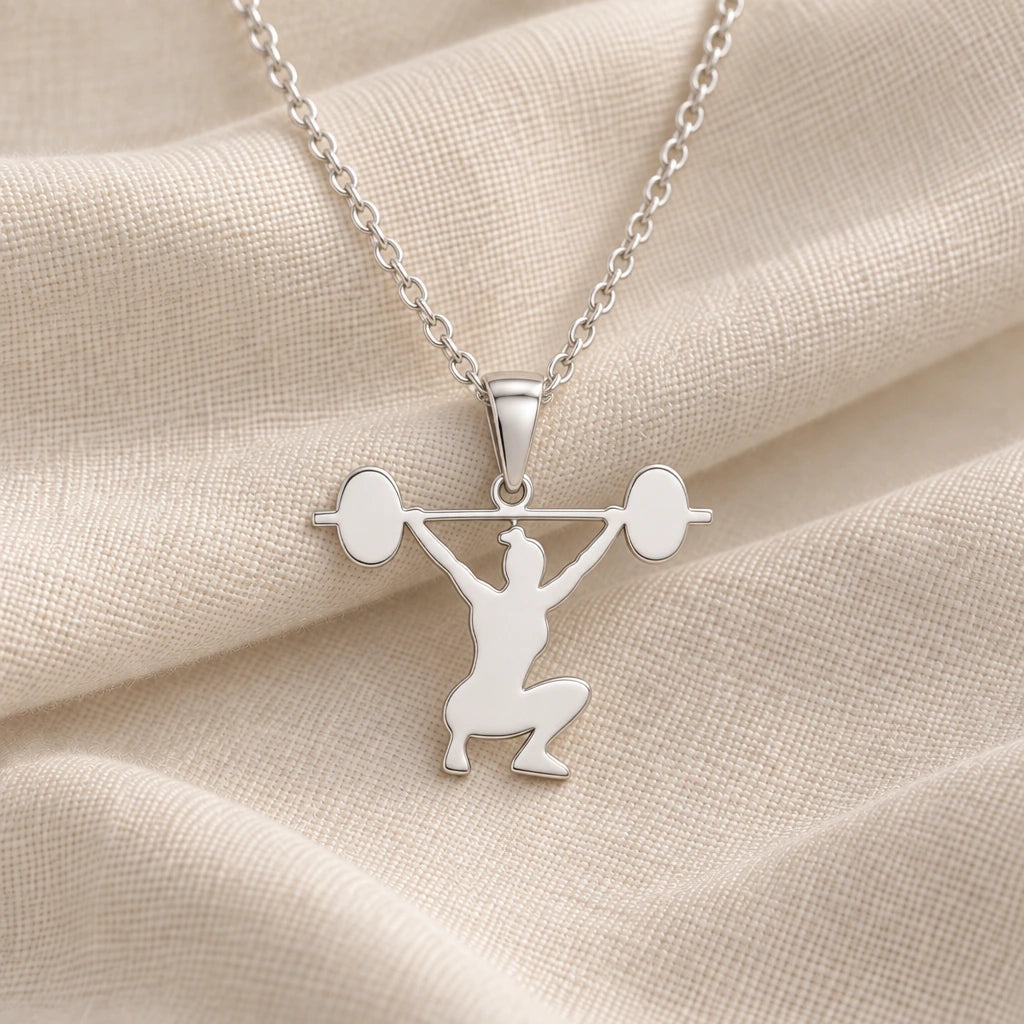 925 sterling silver weightlifter snatch pendant necklace on cream fabric