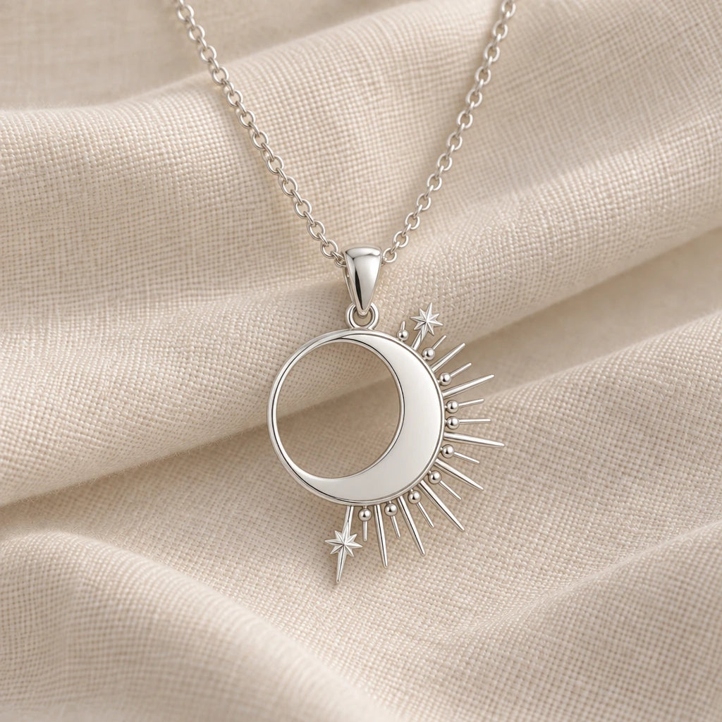 925 sterling silver solar eclipse crescent pendant necklace on cream fabric