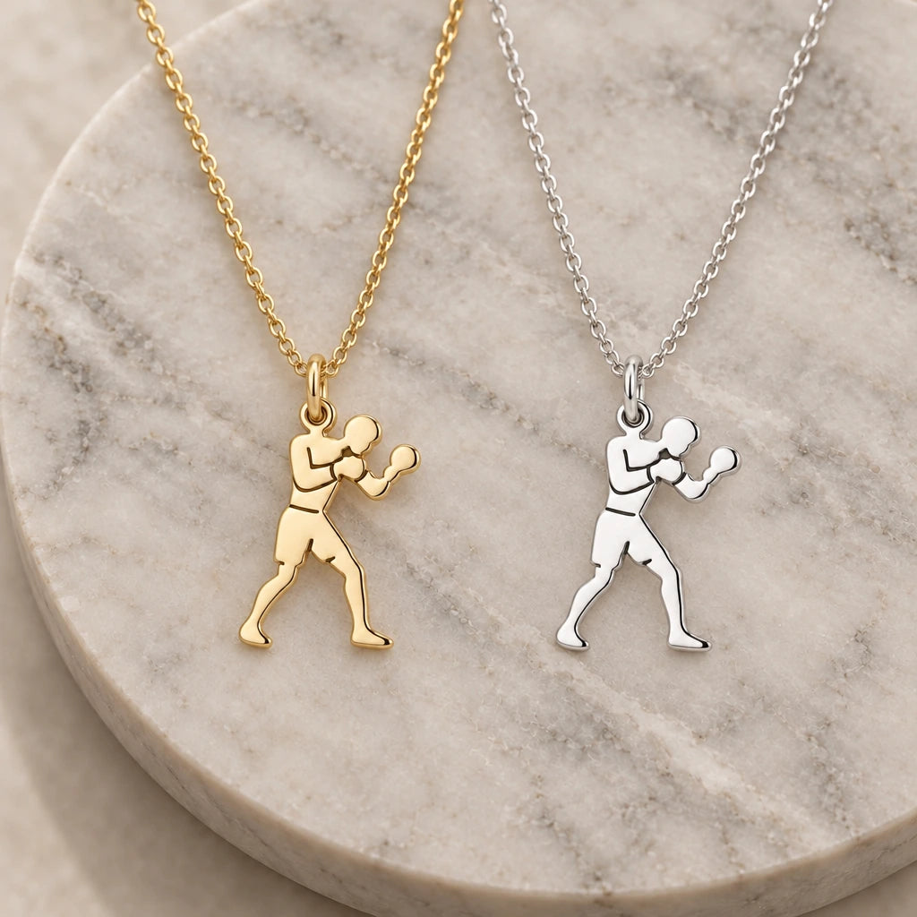 Male Boxer pendant necklace in silver and gold finishes side by side