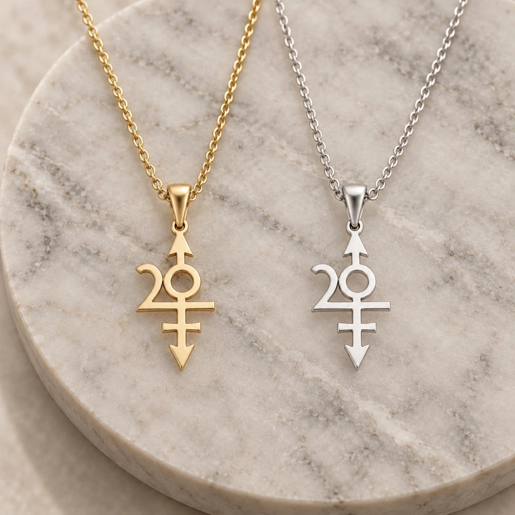 Nibiru Symbol pendant necklace in silver and gold finishes side by side