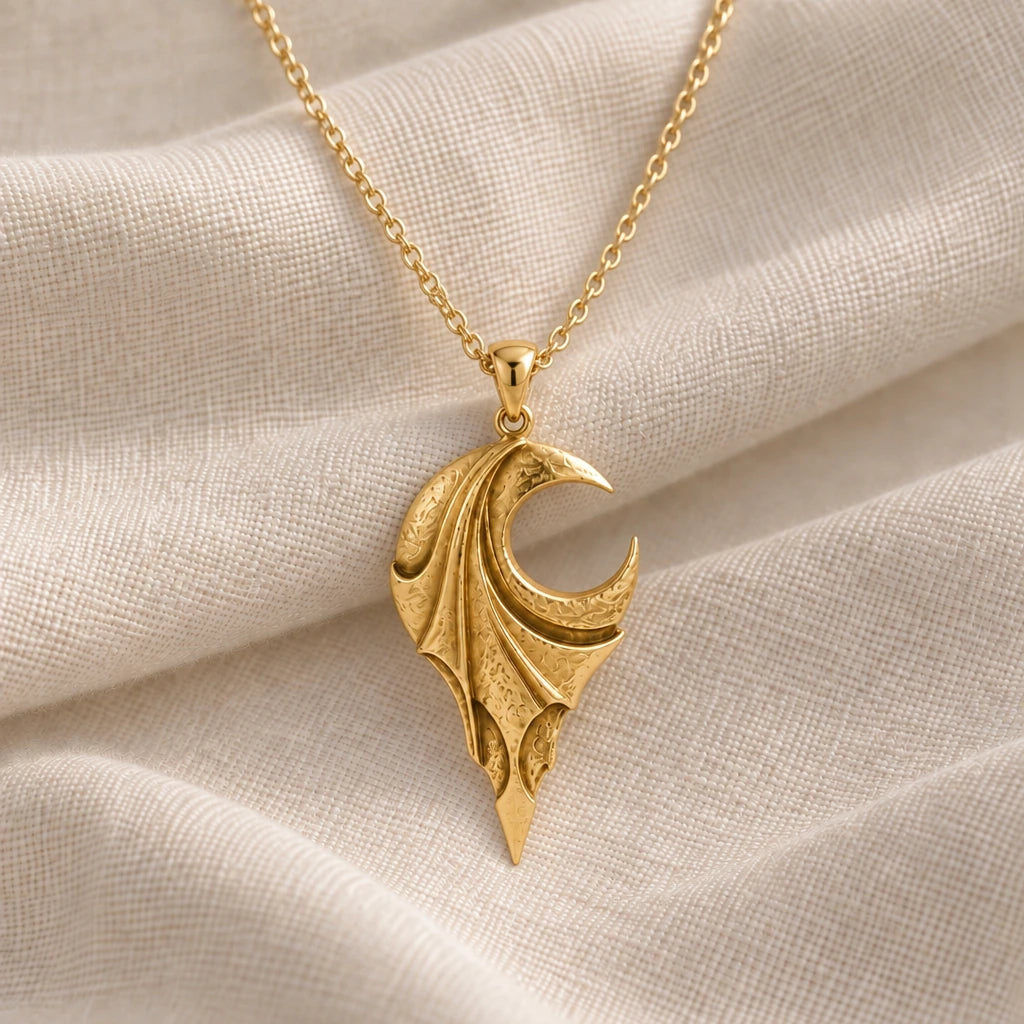 Veiled Eclipse Wing pendant necklace in an 18k gold plated finish