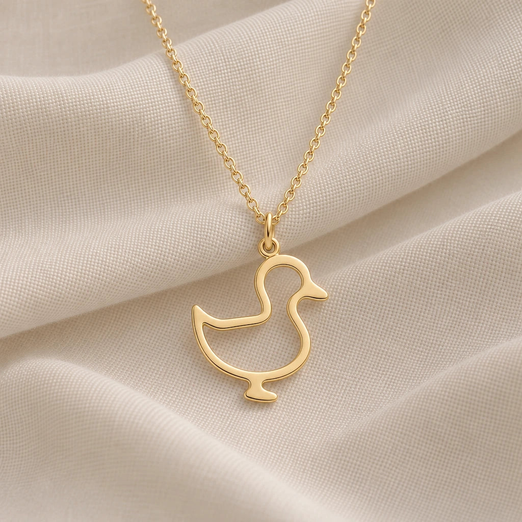 Standing Duck Outline pendant necklace in an 18k gold plated finish