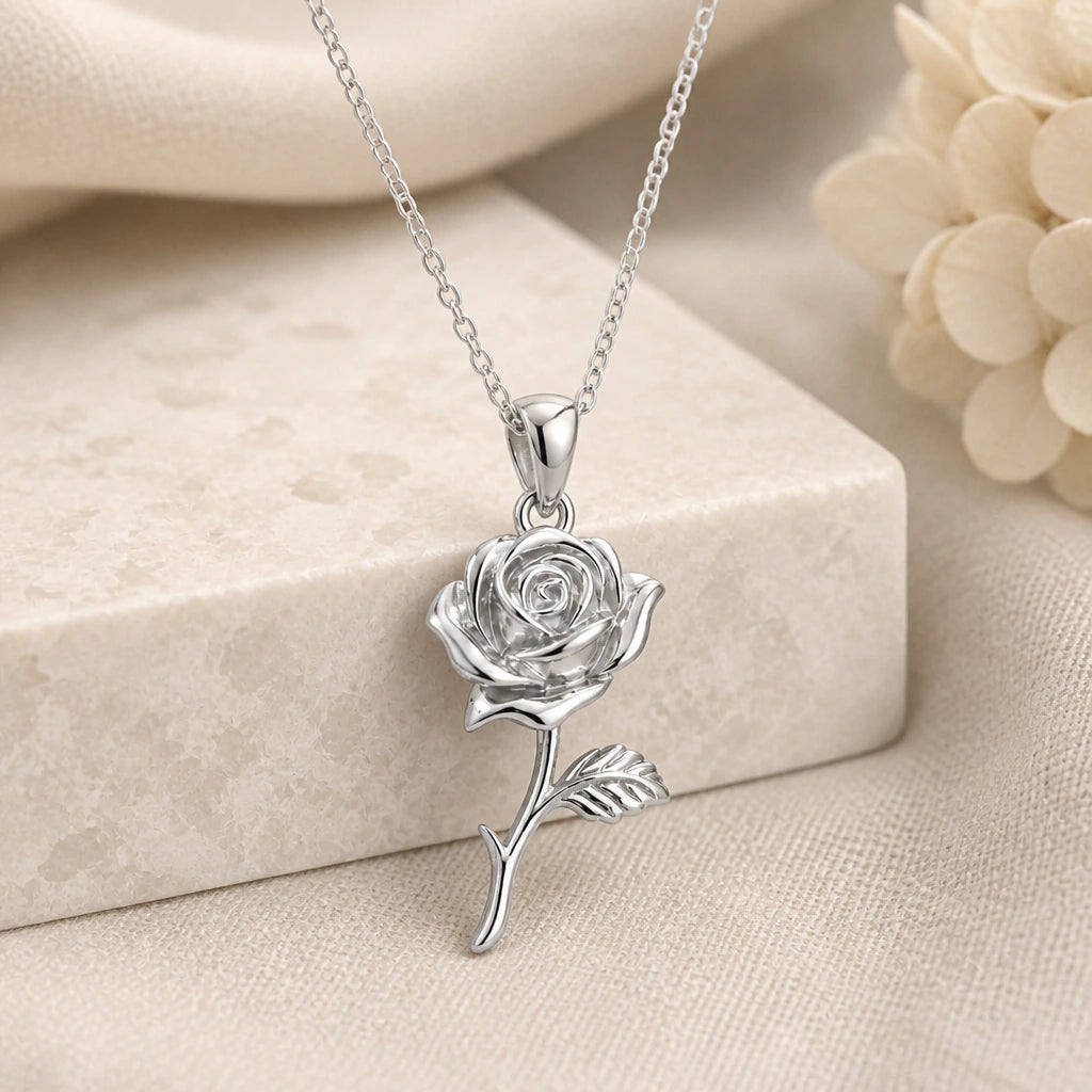 925 sterling silver rose flower pendant necklace on softly folded cream linen