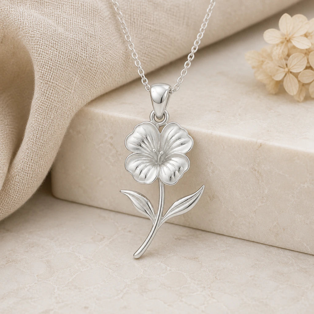 925 sterling silver nasturtium flower pendant necklace on softly folded cream linen