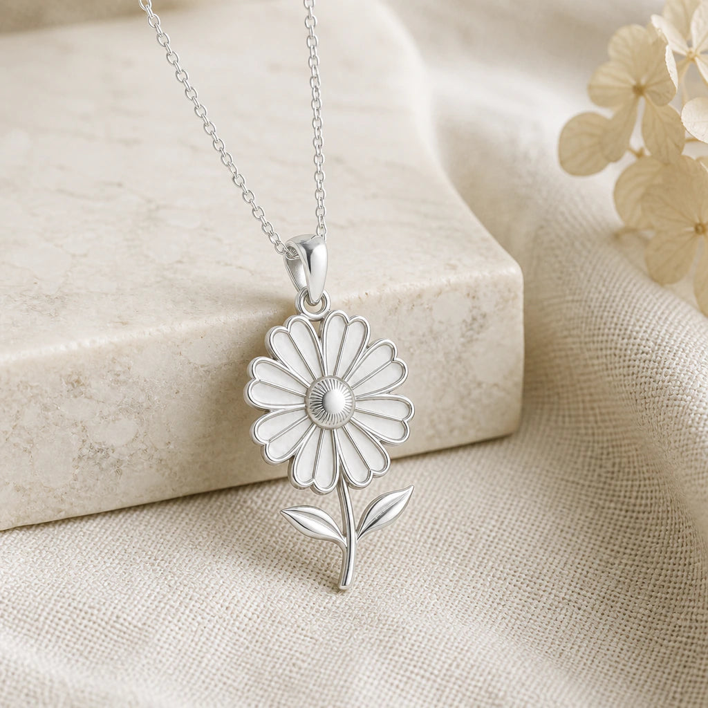 925 sterling silver cosmos bloom flower pendant necklace on softly folded cream linen
