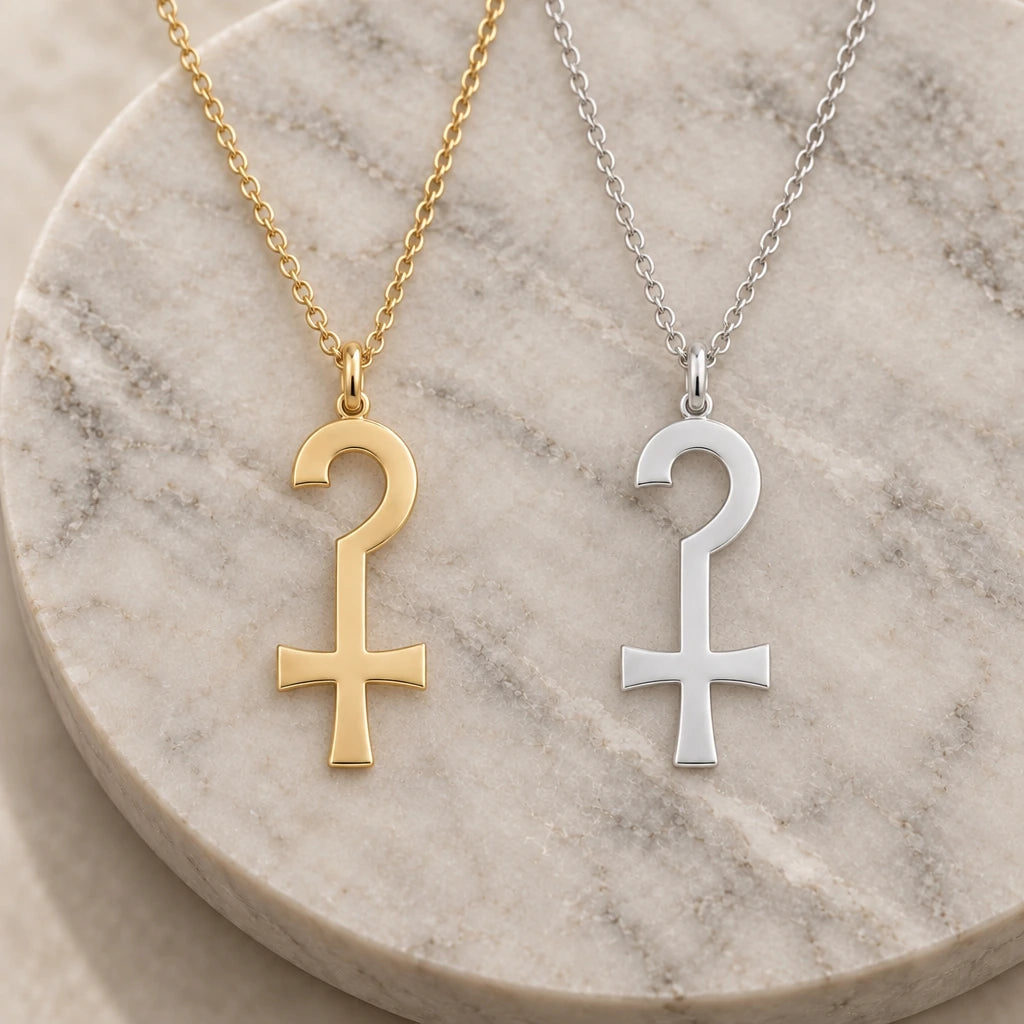 Anubis Crook Symbol pendant necklace in silver and gold finishes side by side