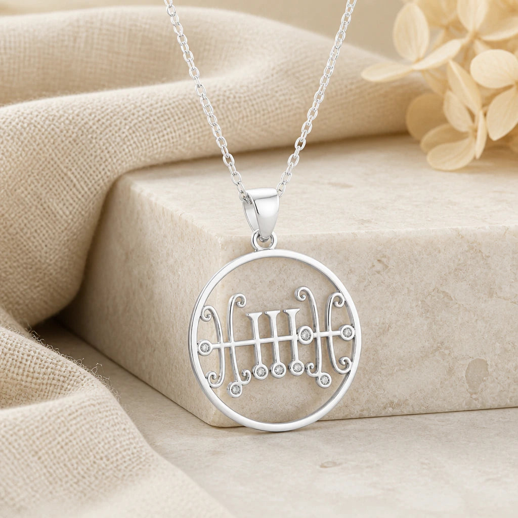 925 sterling silver seal of sallos birthstone pendant necklace on softly folded cream linen