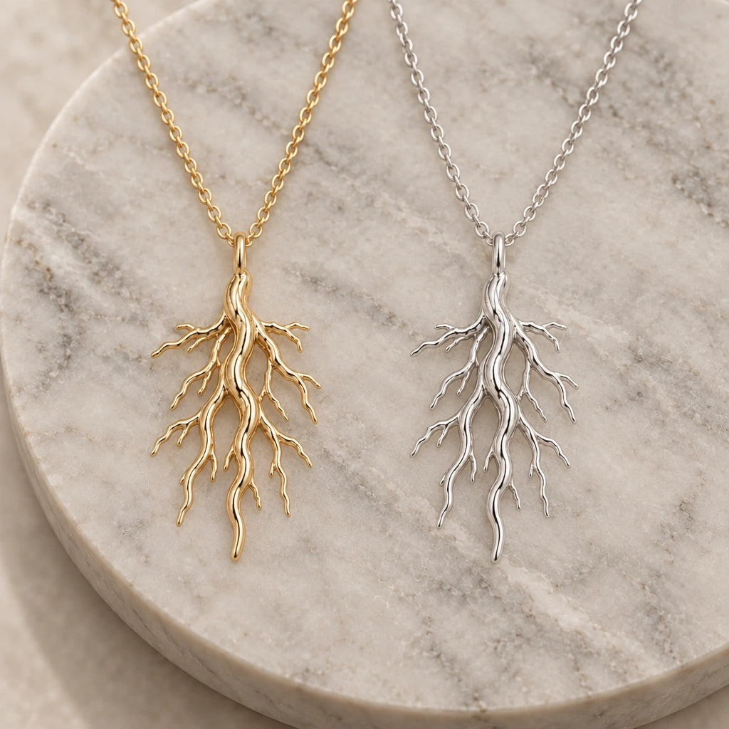 Sacred Root pendant necklace in silver and gold finishes side by side