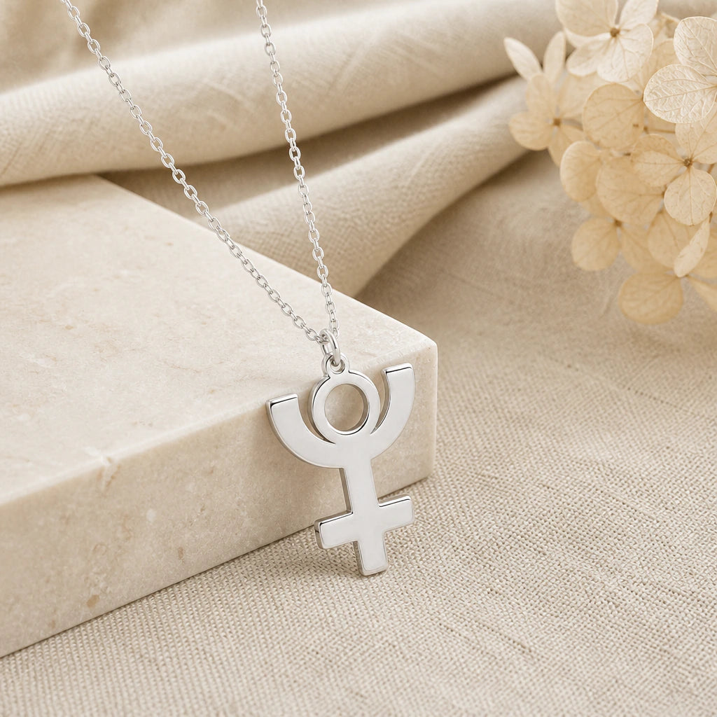 925 sterling silver pluto symbol pendant necklace on softly folded cream linen