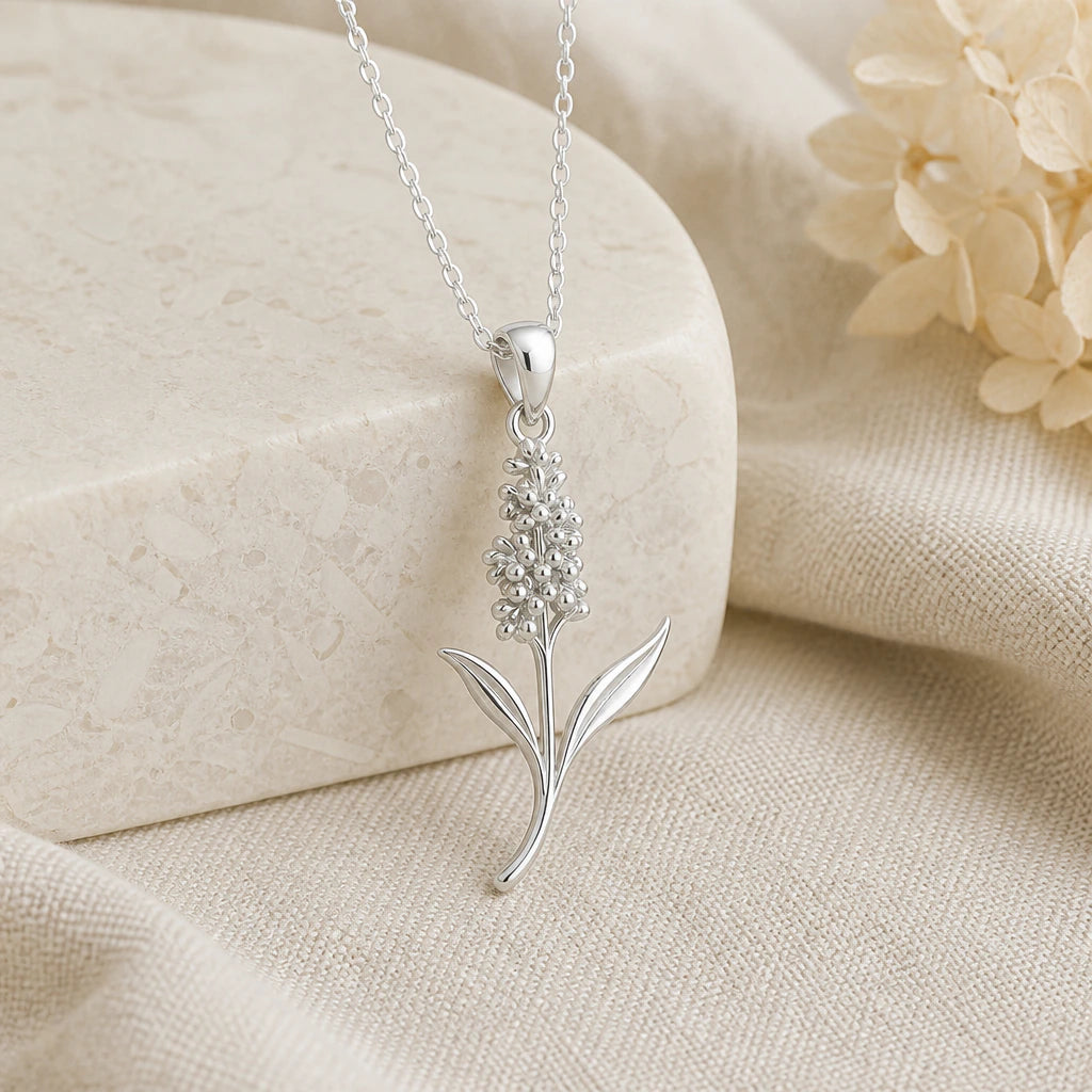 925 sterling silver hyacinth flower pendant necklace on softly folded cream linen