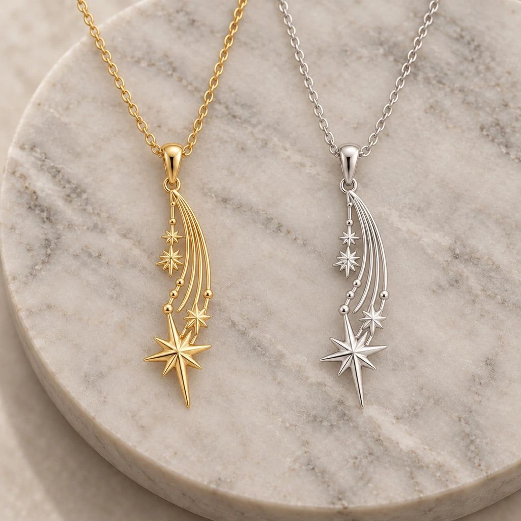 Falling Star Comet pendant necklace in silver and gold finishes side by side