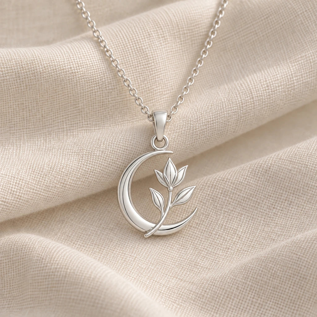 925 sterling silver lunar petal sprig pendant necklace on cream fabric
